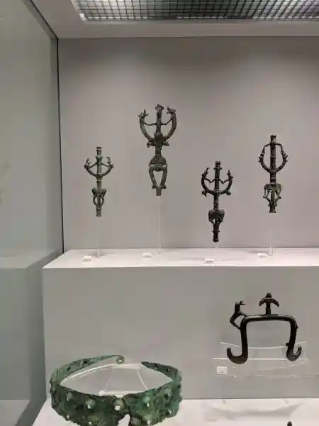 Ancient bronze standard-finials with Master of animals design and decorated diadem from Luristan and Etruria